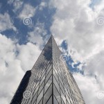 modern-glass-office-building-windows-clouds-bucharest-city-32299988